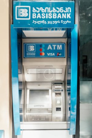 Photo for Batumi, Georgia - 04.07.2021: Blue ATM of Basisbank on the street in Batumi, Georgia - Royalty Free Image