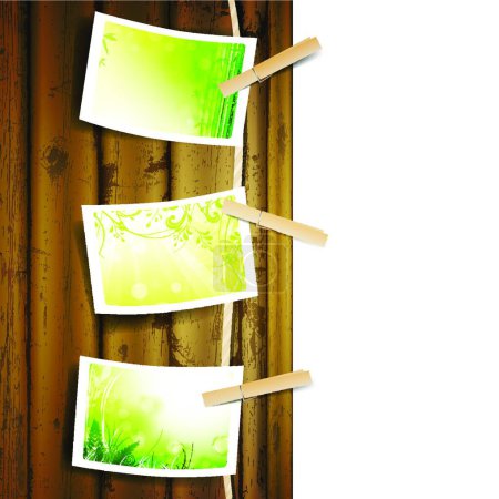 Illustration for "green foliage photos pinned to a rope" - Royalty Free Image