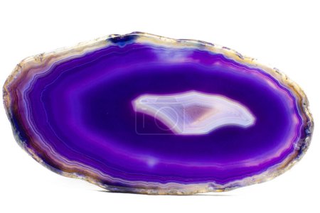 Purple and Blue agate slice crystal , banded chalcedony stone isolated on a white background surface with lots of detail. Abstract purple crystal image with lots of copy space