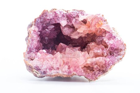 Macro focused vibrant pink amethyst quartz geode crystal, rose hematite amethyst points isolated on a white background surface