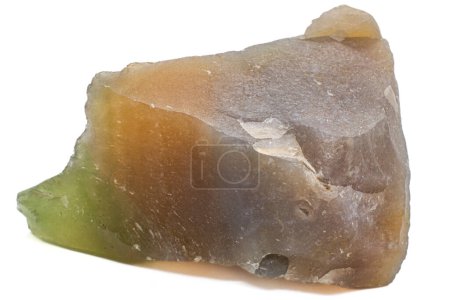 Colourful chunk of agate chalcedony uncut and unpolished chunk of green, orange, brown and purple gemstone close up isolated on a white background surface