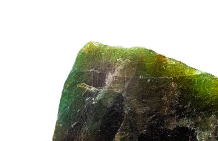 Raw uncut macro-focused Deep green Aventurine, green quartz crystal chunk isolated on a white surface background
