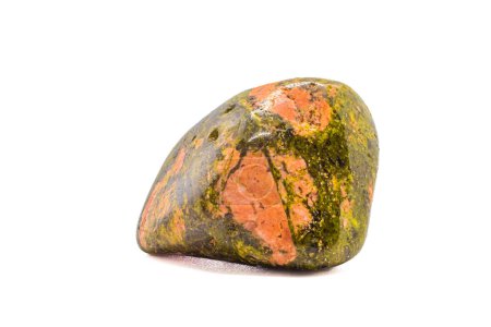 Macro tumbled green and orange unakite jasper crystal, silicate chalcedony mineral variety, isolated on a white surface background  