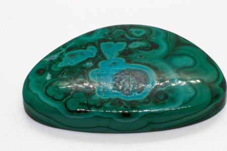 Vibrant Green and blue malachite chrysocolla cabochon polished crystal, copper mineral isolated on a white background surface