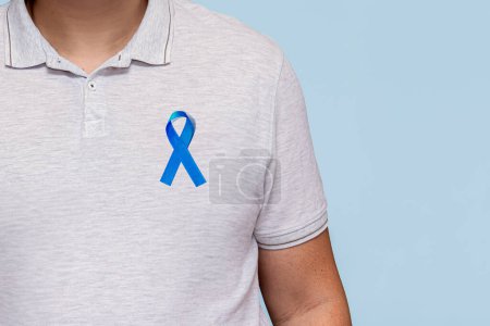 Blue November Prostate Cancer Awareness Month, man in shirt with blue ribbon to support people's life and disease. Health, International Men, Father, Diabetes and World Cancer Day