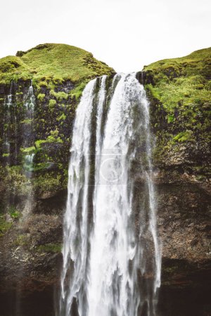 Photo for Vertical photo perfect view of famous powerful Gljufrabui cascade in sunlight. Dramatic and gorgeous scene. Unique place on earth. Location place Iceland, sightseeing Europe. Explore the worlds - Royalty Free Image