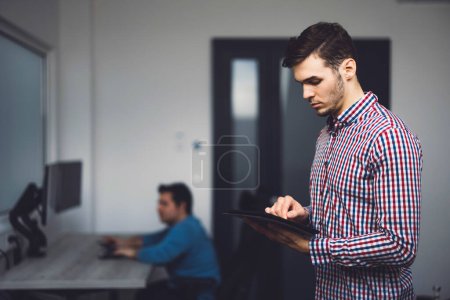 Photo for IT Programmer Working on Desktop Computer. Male Specialist Creating Innovative Software Engineer Developing App, Program, Video Game. Terminal with Coding Language. Over Shoulder. High quality photo - Royalty Free Image