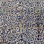 The floral tiles in a round shape on the wall.