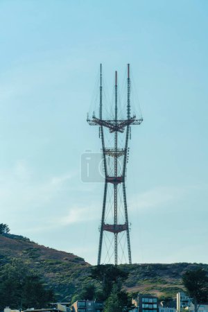 Photo for Sutro tower in shade midday with neighborhood foreground with houses and homes in the city foreground with blue sky and cloudy background. Tall telephone or communication tower in San Francisco. - Royalty Free Image