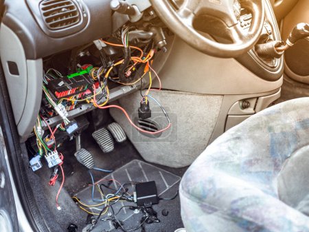 Photo for Repair stolen car. Thief bypass car alarm immobiliser. Intervention in wiring. - Royalty Free Image