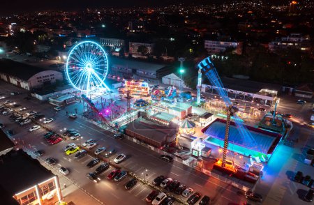 Photo for Night leisure park at Varna Port. Night attraction amusement park aerial shot. Colorful amusement park - Royalty Free Image