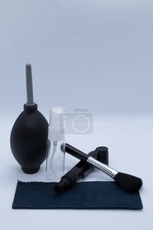 Photo for Cleaning supplies for cameras and various objects on a white background - Royalty Free Image
