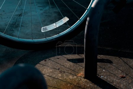 Photo for Bicycle wheel night safety reflector is focused with shadows - Royalty Free Image