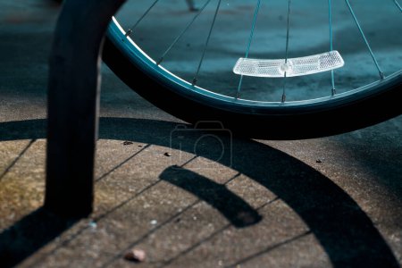 Photo for Bicycle wheel night safety reflector is focused with shadows - Royalty Free Image