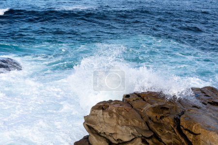 Photo for Waves crashing against the rocks in the atlantic ocean in the town of Baiona, Galicia, Spain - Royalty Free Image
