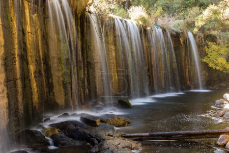 waterfall in the Presa del Pradillo in the Sierra de Guadarrama, Madrid, Spain