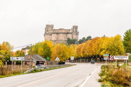 Photo for Town of Manzanares el Real, in Madrid, with the colors of autumn in its trees. - Royalty Free Image