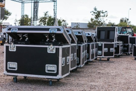 General view of some flight cases during the setting up of the stage of a music festival. High quality photo