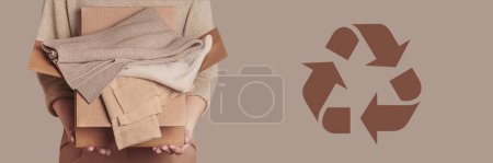 Photo for Woman holding cardboard box with used clothes wardrobe ready to give away and circular economy logo on beige background. Circular fashion, clothing recycling, eco friendly sustainable shopping concept - Royalty Free Image