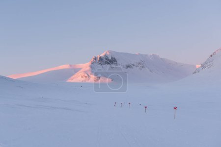 Sunrise alpenglow on the Sylarna Massif during a nordic ski trip in Sweden