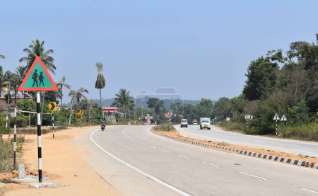 Photo for A picture of Empty National Highway built by NHAI in India with Sign board by the side of the road. - Royalty Free Image
