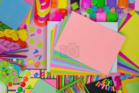 Photo for Flat lay top view and copy space. Art supplies and educational materials are arranged in an aesthetically pleasing way on  universal background. Free space on table. - Royalty Free Image