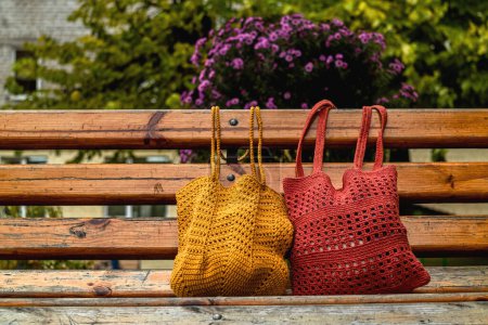 Photo for Eco friendly cotton net bag for shoppingon a wooden bench. Zero waste concept. - Royalty Free Image