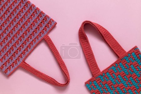 Photo for Two crochet market bag with mosaic pattern on a pink background. Zero waste and eco friendly shopping concept. - Royalty Free Image