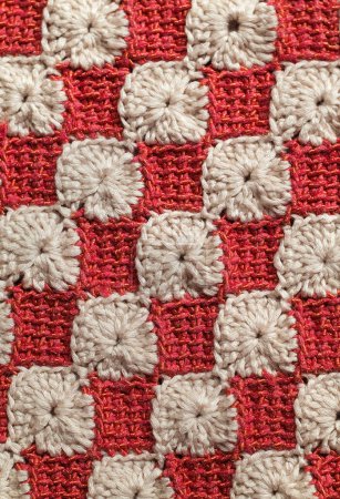 Red white crochet tunisian pattern. Seamless knitted texture.