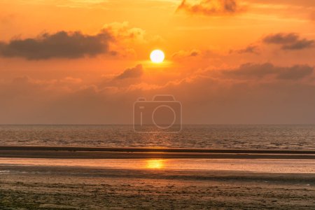 Photo for Scenic view of sunset over Deauville beach in Normandy, France against dramatic golden sky - Royalty Free Image