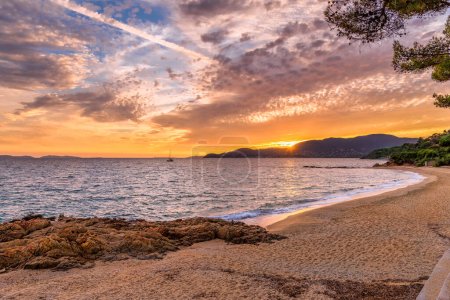 Photo for Scenic view of Gigaro beach in Saint Tropez bay area against dramatic sky at sunset - Royalty Free Image