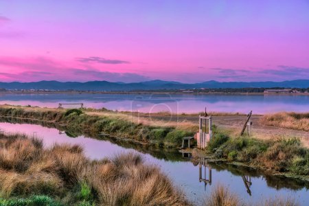 Photo for Scenic view of Les Salins-d'Hyres in Giens peninsula during purple colored blue hour sky in south of France - Royalty Free Image