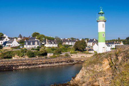 Photo for Scenic view of lighthouse in Clohars Carnoet in Brittany France during low tide - Royalty Free Image