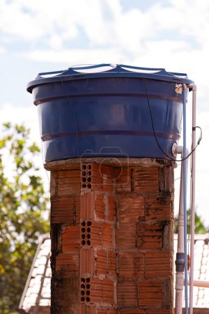 Blue plastic water tank used in residential constructions in Brazil