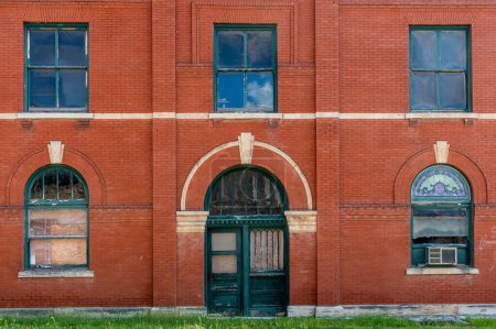 Photo for Beautiful old building with arching windows and doors and old brickwork. - Royalty Free Image