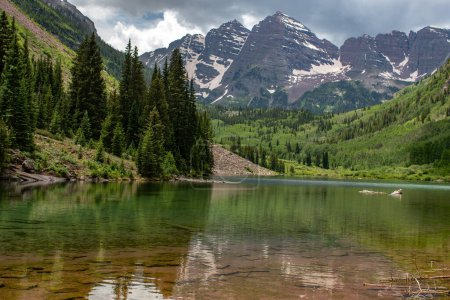 Photo for The Maroon Bells beautifully reflected in the clear waters of Maroon Lake near Aspen, Colorado. - Royalty Free Image