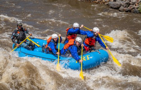 Photo for Truly adventure photograph of a group of people taking on the rough water of the Arkansas River in spring of 2023 after lots of rain and snow melt made for some really exciting paddling. - Royalty Free Image