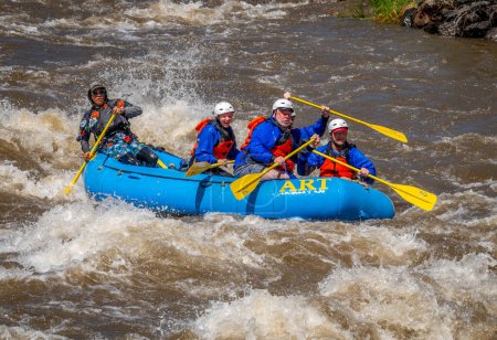 Photo for Truly adventure photograph of a group of people taking on the rough water of the Arkansas River in spring of 2023 after lots of rain and snow melt made for some really exciting paddling. - Royalty Free Image
