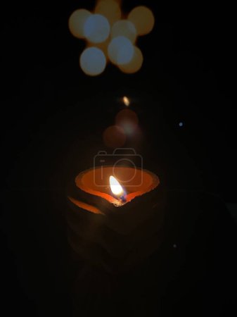 Photo for Clay lamp lit with sesame oil for karthigai that purifies atmosphere - Royalty Free Image