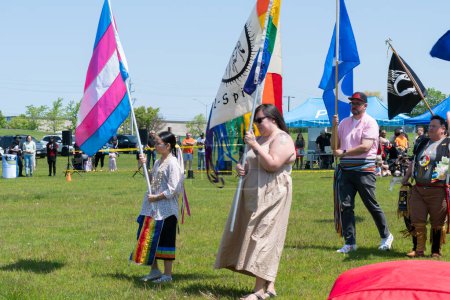Photo for Pride flag with 2-Spirited Native American symbol. Trans or Transgender. Metis Flag and missing in action POW MIA flag. Display of flags at Two Spirits Pow wow: Toronto, Ontario, Canada - May 27, 2023 - Royalty Free Image