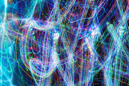 Photo for Psychedelic abstract long exposure motion colour lights. Light trails, leaks and glowing electricity. Music visualisation abstraction background. Christmas holiday festive lights. - Royalty Free Image