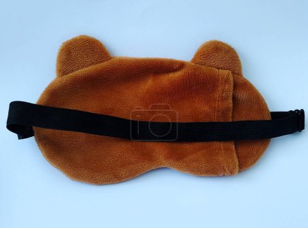 Photo for Blindfold or sleep mask with cute brown shape, photo taken from the front angle - Royalty Free Image