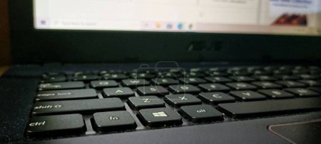Photo for Central Java, Indonesia. Juny 14, 2021: Close up view of black laptop keyboard - Royalty Free Image