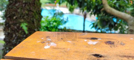 Photo for Selective focus of table with a beautiful swimming pool background under the mountains - Royalty Free Image