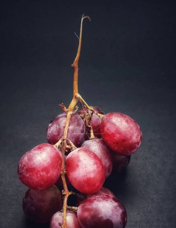 Photo for Close up view of a sprig of grapes was photographed with the concept of giving a light effect to the grapes - Royalty Free Image