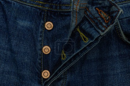 Close-up of unbuttoned blue button-down jeans, top view