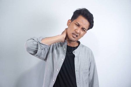 Photo for Young man suffering from neck pain. Headache pain. - Royalty Free Image