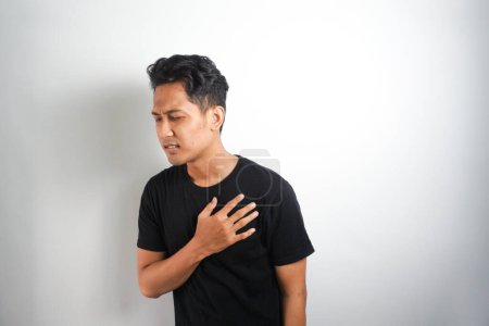 Photo for Healthcare concept. Man suffering from chest pain with painful expression - Royalty Free Image