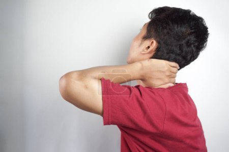 Photo for Young hispanic man suffering neck pain due to sedentary lifestyle. - Royalty Free Image