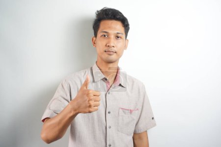 Photo for Happy man thumbs up sign full length portrait on white background - Royalty Free Image
